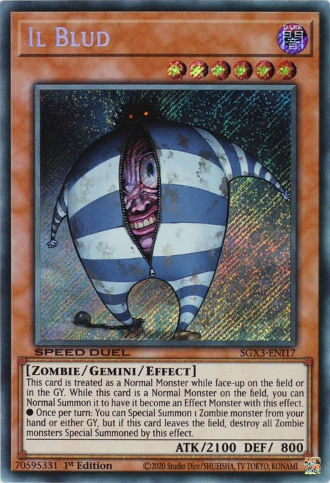 A "Yu-Gi-Oh!" trading card depicting the monster "Il Blud [SGX3-ENI17] Secret Rare." This creepy, egg-shaped zombie with striped blue and white patterns features spikes and a sinister grin. The Secret Rare card outlines its special Zombie/Gemini/Effect properties, attack (2100), defense (800), and Speed Duel GX capabilities.