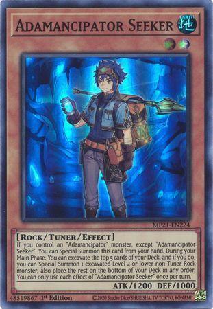 A Yu-Gi-Oh! trading card named "Adamancipator Seeker [MP21-EN224] Super Rare" from the 2021 Tin of Ancient Battles. It depicts an anime-style character in adventure gear with a pickaxe over their shoulder, standing in a cave with a blue glow. The Tuner/Effect Monster’s text details its rock attributes along with 1200 ATK and 1000 DEF points.
