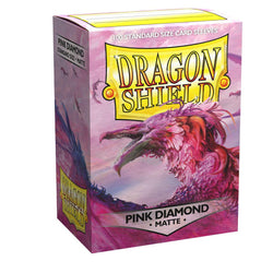 A box of Arcane Tinmen's Dragon Shield: Standard 100ct Sleeves - Pink Diamond (Matte) showcases an illustration of a majestic, pink, dragon-like creature with a long beak and feathers against a pastel background. With a clear front, the box contains 100 standard-size card sleeves.