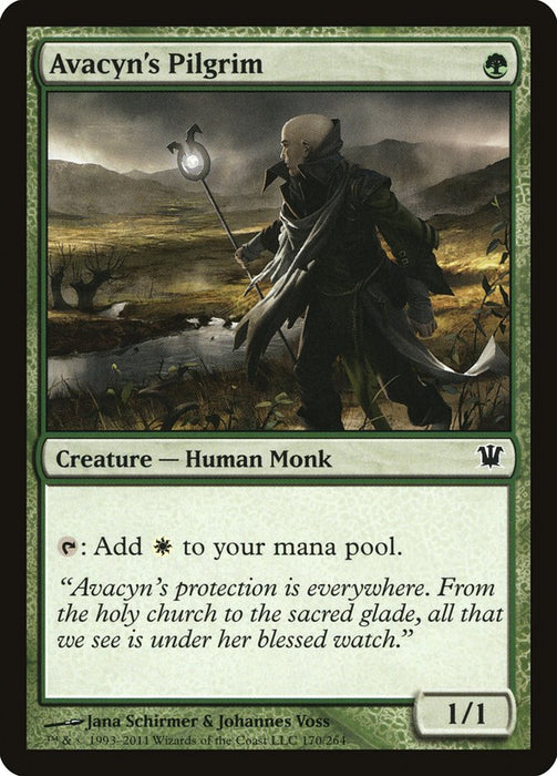 A "Magic: The Gathering" card named Avacyn's Pilgrim [Innistrad] displays a green-bordered image of a robed Human Monk holding a staff, set against a hilly, windswept landscape in Innistrad. The card has a mana cost of one green and features stats of 1/1. Its description elaborates on the card's abilities and lore.