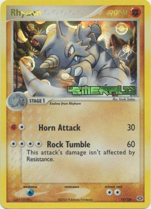 A rare Pokémon trading card featuring Rhydon at the Stage 1 evolution level. The card belongs to the EX: Emerald set, numbered 19/106. Rhydon has 90 HP and two moves: Horn Attack (deals 30 damage) and Rock Tumble (deals 60 damage, unaffected by Resistance). The card has a yellow border and detailed artwork of Rhyd.

Product Name: Rhydon (19/106) (Stamped) [EX: Emerald]
Brand Name: Pokémon