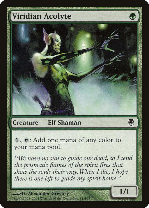 A Magic: The Gathering card named "Viridian Acolyte [Darksteel]." This Darksteel Creature features an Elf Shaman with green skin casting a spell against a dark, mystical background. Text reads, “Add one mana of any color to your mana pool.” Flavor text speaks of tending prismatic flames for souls' guidance. Artist: Alexander Gregory. Power/Toughness: 1/1.