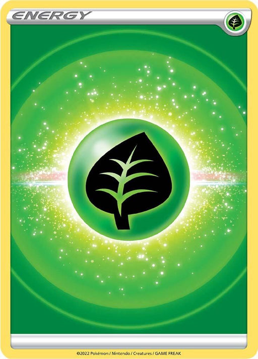 The image is a Pokémon trading card featuring a green leaf symbol in a black circle, representing Grass Energy [Sword & Shield: Brilliant Stars] from the Pokémon series. The background has a green gradient with sparkling, star-like particles radiating from the center. The card has a yellow border and includes ©2022 Pokémon / Nintendo / Creatures / GAME FREAK text at the bottom.