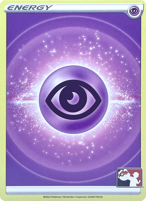 The Pokémon Psychic Energy card from the Prize Pack Series Two displays a captivating design, highlighted by a central eye symbol amidst a radiant energy field adorned with sparkles, all set against a gradient purple backdrop. The card features the word "Energy" at the top and proudly bears the Prize Pack Series Two logo in the bottom right corner.