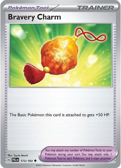 The image shows a Bravery Charm (173/193) [Scarlet & Violet: Paldea Evolved] Pokémon Tool card from the Trainer category in the new Scarlet & Violet series. The card depicts an orange, faceted, gem-like charm with a red tassel and a looped string against a green, radiant background. The text indicates the Basic Pokémon it's attached to gains +50 HP.