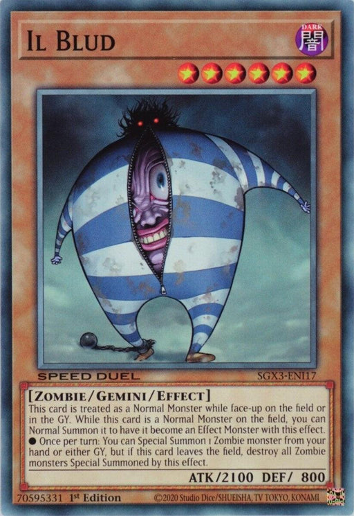 The Yu-Gi-Oh! card titled "Il Blud [SGX3-ENI17] Common" features a creepy, humanoid figure in a blue and white striped outfit with a large, round body and a long tongue. With its dark purple frame, this Zombie Gemini Monster showcases its stats (ATK/2100 DEF/800) and special traits for Speed Duel GX.