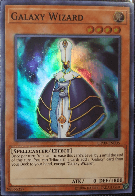 The image showcases a **Yu-Gi-Oh!** trading card from the 2013 Zexal Collection Tin titled "**Galaxy Wizard [ZTIN-EN011] Ultra Rare**". This Level 4 LIGHT attribute Spellcaster/Effect Monster has 0 ATK and 1800 DEF. It allows you to increase its level by 4 once per turn and tribute it to add a "Galaxy" card from your deck, except