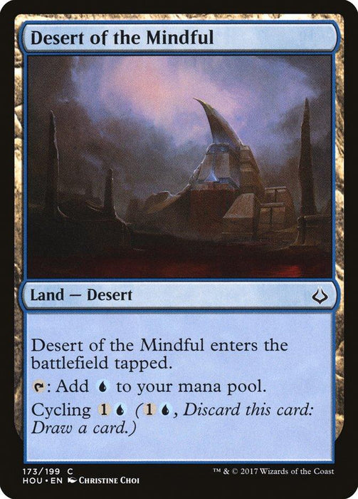 Magic: The Gathering card named "Desert of the Mindful [Hour of Devastation]." This land — desert card depicts a rocky, eerie landscape with jagged structures under a brooding sky. It enters the battlefield tapped, adds blue mana, and has a cycling cost of 1 colorless and 1 blue mana.