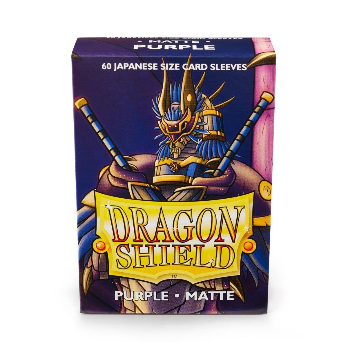 A box of Dragon Shield: Japanese Size 60ct Sleeves - Purple (Matte) by Arcane Tinmen. The packaging features an illustration of an armored, dragon-themed warrior wielding two swords, with the text 