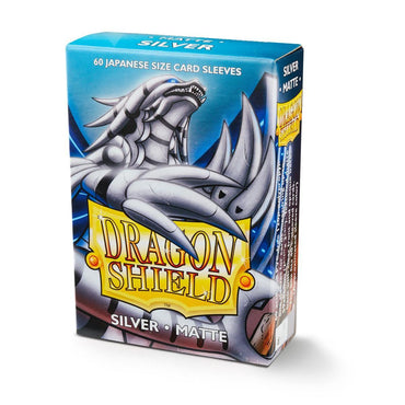 A box of Dragon Shield: Japanese Size 60ct Sleeves - Silver (Matte) by Arcane Tinmen, perfect for Japanese card games. The packaging showcases an illustration of a metallic dragon with wings and claws. The text reads "60 Japanese size card sleeves" at the top and features "Dragon Shield" in a yellow shield at the center, with "Silver Matte" on the side.