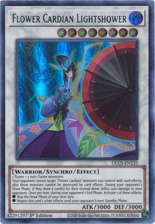 An image of a Yu-Gi-Oh! trading card titled "Flower Cardian Lightshower (Green) [DLCS-EN135] Ultra Rare." The card showcases a Synchro/Effect Monster warrior holding a fan, set against a colorful, patterned background. Text at the bottom lists it as a "Warrior/Synchro/Effect" type with ATK/DEF of 3000/3000. Serial number: