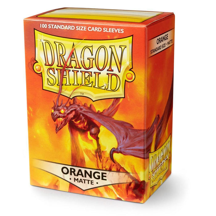The image shows a box of Arcane Tinmen's Dragon Shield: Standard 100ct Sleeves - Orange (Matte). The predominantly orange box features an illustration of a menacing dragon on the front. Labeled "Orange Matte," it states it contains 100 standard-size matte sleeves. The Dragon Shield logo is prominently displayed at the top.