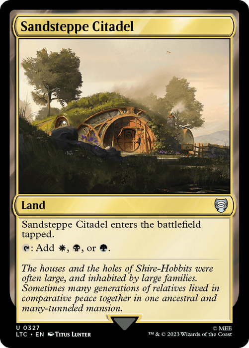 Magic: The Gathering card titled "Sandsteppe Citadel [The Lord of the Rings: Tales of Middle-Earth Commander]." The illustration evokes Tales of Middle-Earth, showing a scenic landscape with a large grassy hill. Embedded in the hill is a cozy hobbit-like home with a round door, surrounded by vibrant plants and trees. The card text and details indicate it's a Land card.