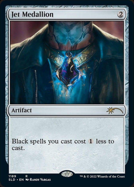 A Magic: The Gathering card titled "Jet Medallion [Secret Lair Drop Series]." This rare artifact depicts a glowing gemstone on a necklace worn by a person in dark clothing. Text reads: "Black spells you cast cost 1 less to cast." The card has a 2-mana cost and is part of the Secret Lair Drop Series, featuring art by Randy Vargas.
