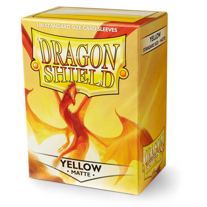 The Arcane Tinmen Dragon Shield: Standard 100ct Sleeves in Yellow (Matte) are displayed in a box emphasizing their durable shuffle-ability. The yellow packaging showcases artwork of an orange dragon, with "100 Standard Size Matte Sleeves" clearly marked on the top, and the words "Yellow" and "Matte" printed on the lower section of the box.