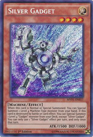 A Yu-Gi-Oh! card titled "Silver Gadget [MVP1-ENS17] Secret Rare." The Effect Monster features an illustration of a silver, humanoid robot with mechanical limbs and a glowing blue core, set against a holographic background. This Secret Rare from Dark Side of Dimensions displays its effect, attributes, and stats: ATK 1500, DEF 1000.