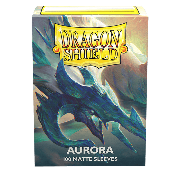 A box of Dragon Shield: Standard 100ct Sleeves - Aurora (Matte) featuring an illustration of a blue dragon with a long neck and sharp features. "Dragon Shield" is written in bold yellow letters at the top, and "Aurora" in white letters near the bottom with "100 Matte Sleeves" beneath it. These TCG card sleeves from Arcane Tinmen ensure premium protection for your cards.