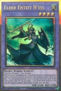 Image of a Yu-Gi-Oh! card titled "Elder Entity N'tss [MAGO-EN026] Gold Rare." The Gold Rare card features a green-robed, female-like entity holding a staff with a glowing orb at the top. This 4-star Light attribute Fusion/Effect Monster boasts an impressive ATK of 2500 and DEF of 1200, and belongs to the Fairy category.