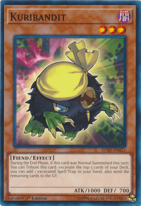 A Yu-Gi-Oh! trading card titled "Kuribandit [SDSH-EN021] Common," an Effect Monster from the Shaddoll Showdown series. It depicts a furry, black creature with red eyes, wearing a yellow bandana. The card has 1000 ATK and 700 DEF points. Description and effect text are visible at the bottom. This Common Rarity card is part of the "Fi