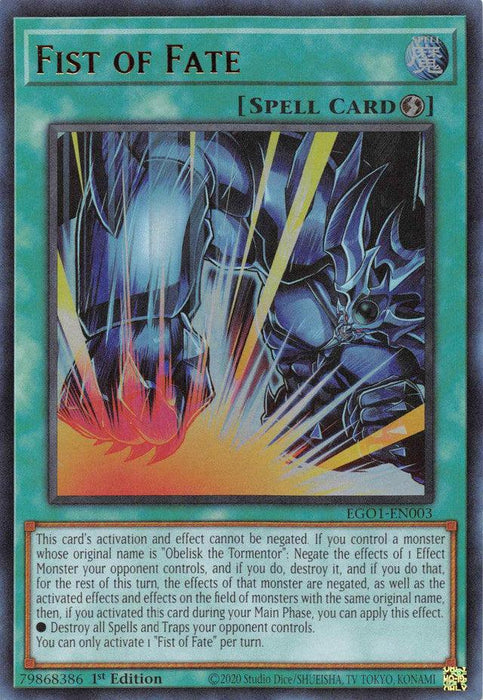 A Yu-Gi-Oh! trading card titled "Fist of Fate [EGO1-EN003] Ultra Rare." The Quick-Play Spell card features a blue border and a detailed illustration of a large armored fist, associated with Obelisk the Tormentor, emitting a powerful energy blast. The card text describes its effects and conditions of use for the Egyptian God Deck. This is a first edition card with the code EGO1-EN003.