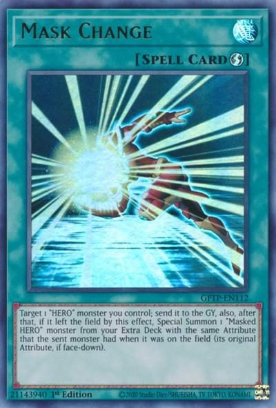 Image of the Yu-Gi-Oh! card "Mask Change [GFTP-EN112] Ultra Rare." The Quick-Play Spell card shows a bright, glowing silhouette of a figure with arms extended, transforming in a burst of blue and white light. It allows targeting a "HERO" monster, sending it to the graveyard, and summoning a "Masked HERO" monster.